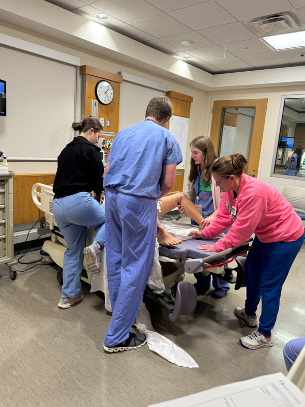 Group of residents working with a manekin